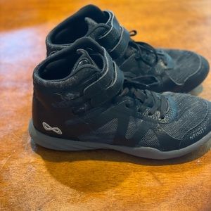 Nfinity child beast cheer shoes. Color midnight. Comes with carrying case.
